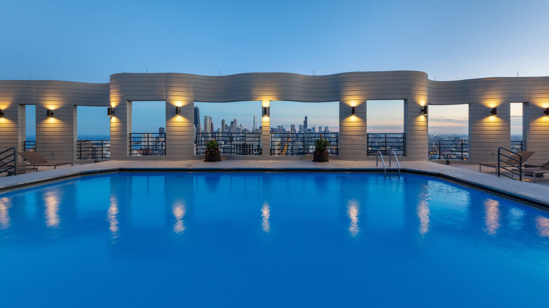 Rooftop Pool Deck Overlooking City Skyline